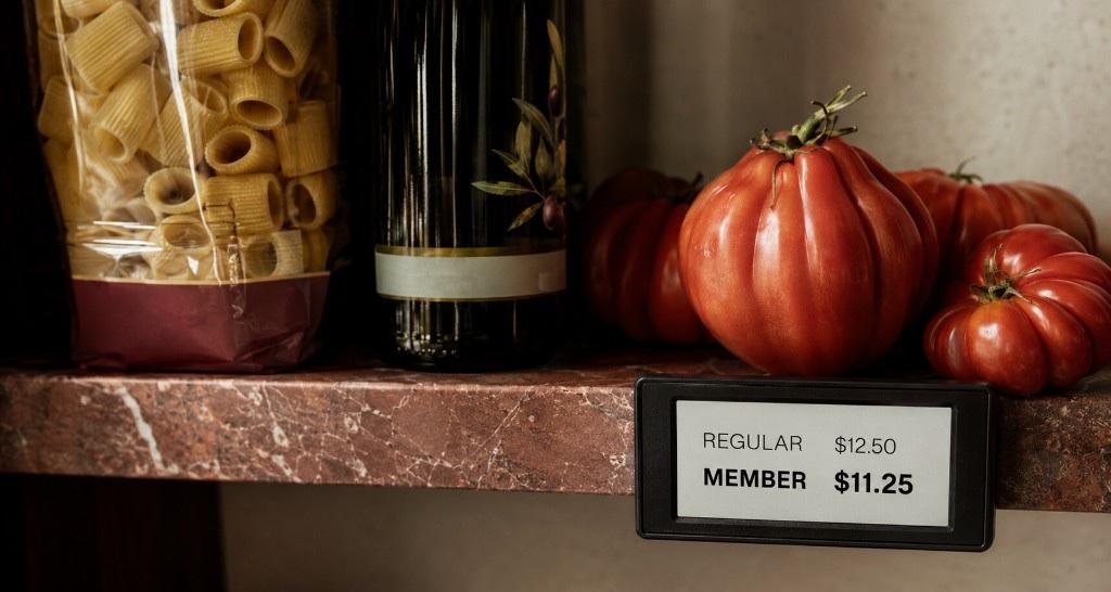 An electronic shelf label showing a regular price of $12.50 and a member price of $11.25